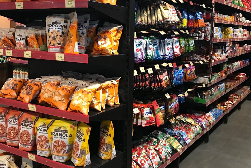 Food-grade plastic bags line the shelves of a supermarket