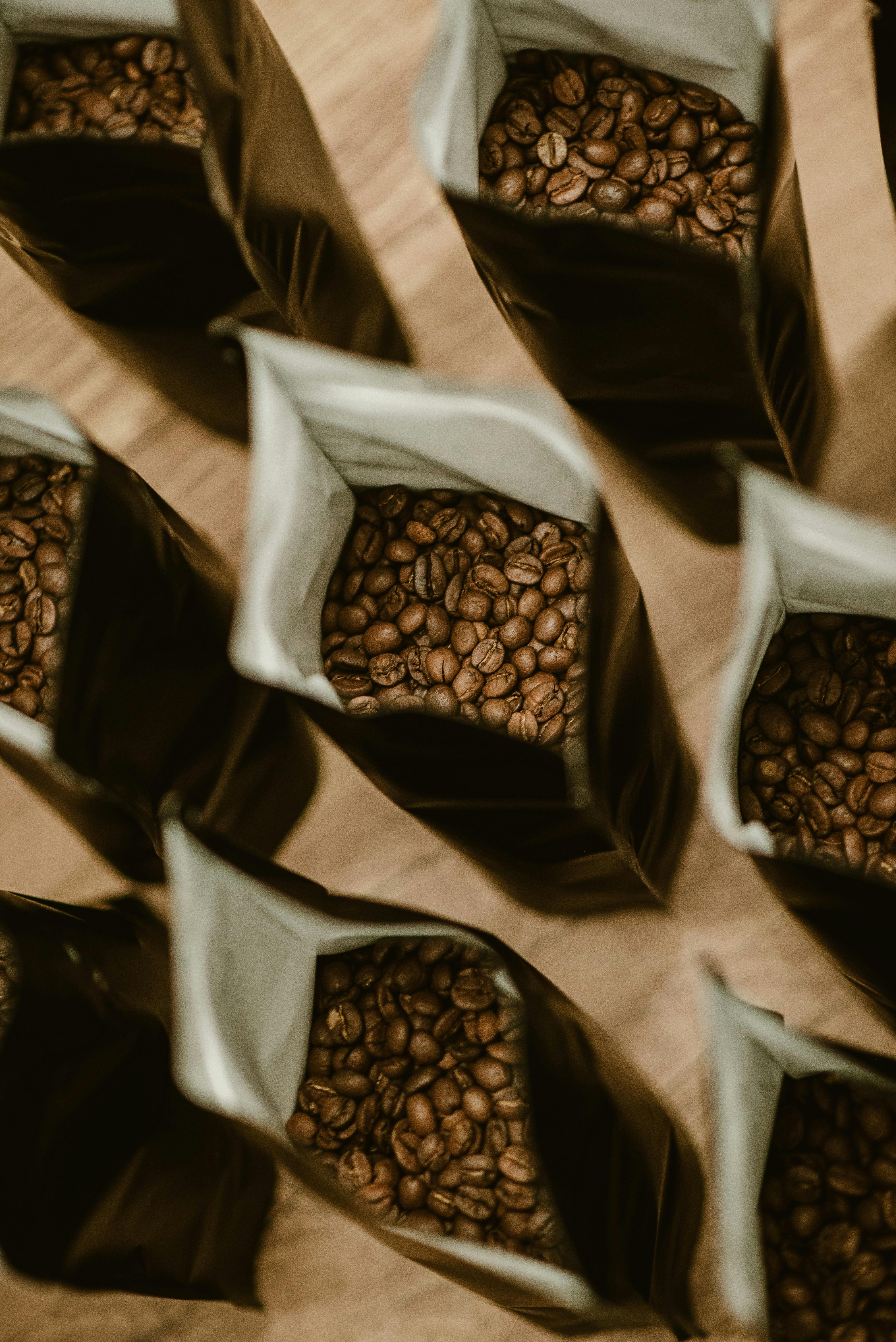 Open stand-up coffee packaging from RubeeFlex Packaging shows fresh coffee beans